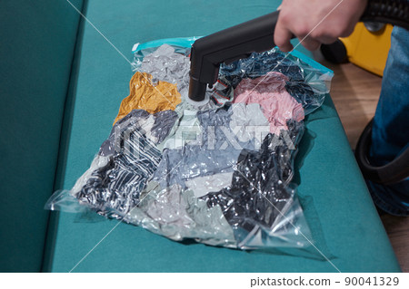 Space saver saving seal bag sucking air vacuum clothing storage compressed package. 90041329