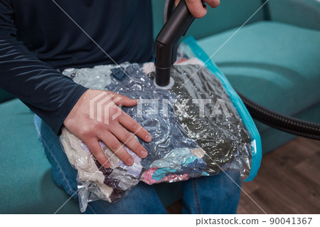 Space saver saving seal bag sucking air vacuum clothing storage compressed package. Space saver saving seal bag sucking air vacuum clothing storage compressed package. 90041367