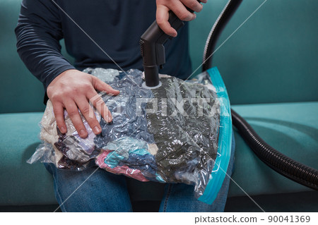 Space saver saving seal bag sucking air vacuum clothing storage compressed package. Space saver saving seal bag sucking air vacuum clothing storage compressed package. 90041369