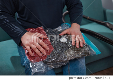 Space saver saving seal bag sucking air vacuum clothing storage compressed package. Space saver saving seal bag sucking air vacuum clothing storage compressed package. 90041605