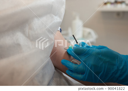 Young woman in blood transfusion concept hand. 90041822