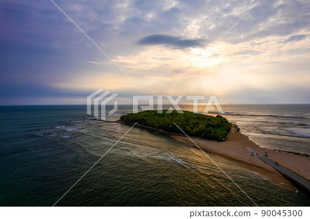 Aoshima, Aoshima Shrine, and a demon's washing board in Aoshima, Miyazaki Prefecture, where the morning light taken aerial with a drone is fantastic 90045300