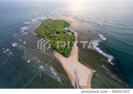 Fantastic morning aerial shot with a drone Aoshima, Miyazaki Prefecture, Aoshima Shrine, and a demon's washing board 90045307