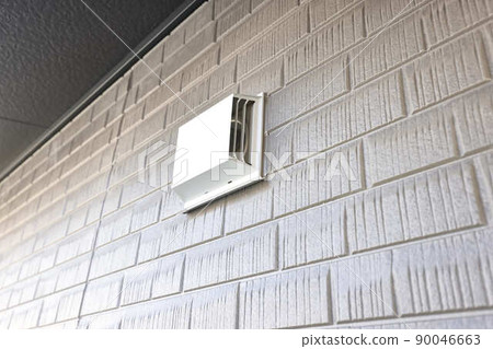 Ventilation fan attached to the wall of the house Exhaust intake Ventilation fan attached to the wall of the house Exhaust intake 90046663