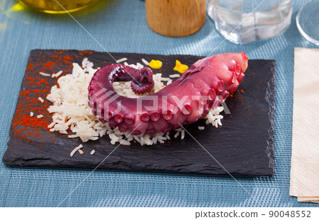 Slate of appetizing boiled octopus with rice Slate of appetizing boiled octopus with rice 90048552