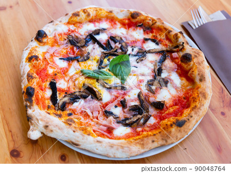 Freshly baked homemade pizza with eggplant and ham Freshly baked homemade pizza with eggplant and ham 90048764