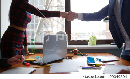 Business concept. A conference. People greeting each other with a handshake 90049204
