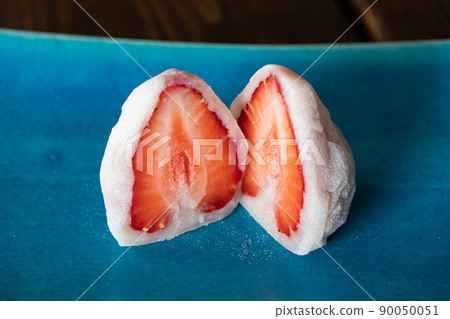 A close-up of Fruit Daifuku. Japanese sweets made by wrapping bright red strawberries with fertilizer and white bean paste. 90050051