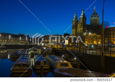 View of Basilica of Saint Nicholas at night time, near the Central railway Station,Amsterdam, Netherlands 90050817