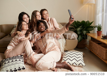Woman Filming Video with Friends Woman Filming Video with Friends 90051510
