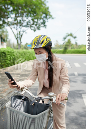 Checking Phone on Way to Office 90053028