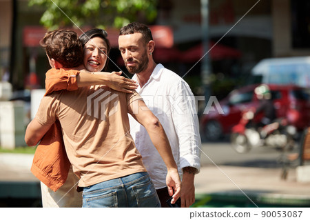 Woman Hugging Her Friend or Coworker Woman Hugging Her Friend or Coworker 90053087