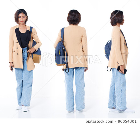 Full length of Asian Indian 20s working woman with curl hair hold cell smart phone backpack blazzer 90054301