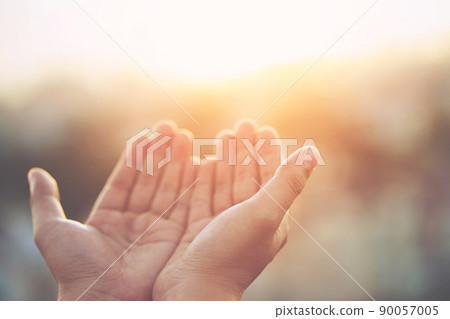 Human hands open palm up worship Praying with faith and belief in God of an appeal to the sky. Concept Religion and spirituality with believe Power of hope or love and devotion. filler tone vintage. Human hands open palm up worship Praying with faith and belief in God of an appeal to the sky. Concept Religion and spirituality with believe Power of hope or love and devotion. filler tone vintage. 90057005