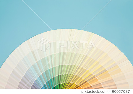 A painter is choosing a paint shade for the interior of the house's walls. with interior A painter is choosing a paint shade for the interior of the house's walls. with interior 90057087