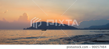 Panorama of Alanya peninsula at dusk. Silhouette on the background of the evening sky with clouds 90057464