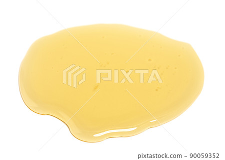 Puddle of honey isolated over white background. Puddle of honey isolated over white background. 90059352