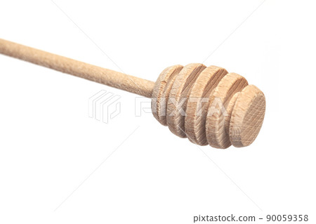 Wooden honey dipper isolated on a white background. 90059358