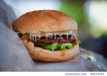 Hamburger is a fast food in fastfood restaurant Hamburger is a fast food in fastfood restaurant 90059463