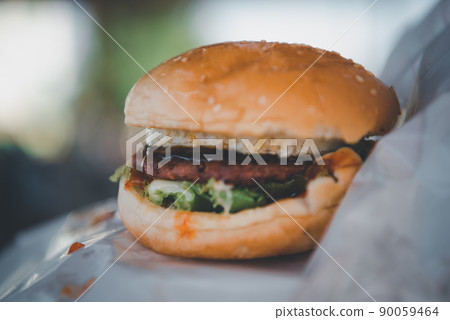 Hamburger is a fast food in fastfood restaurant Hamburger is a fast food in fastfood restaurant 90059464