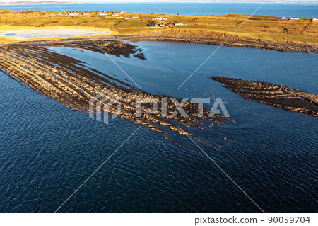 Aerial view of the amazing coast at St Johns Point next to Portned Island in County Donegal - Ireland. 90059704