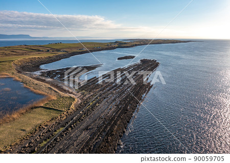 Aerial view of the amazing coast at St Johns Point next to Portned Island in County Donegal - Ireland. 90059705