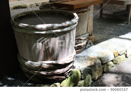 A landscape with a large wooden pickle barrel in front of the store A landscape with a large wooden pickle barrel in front of the store 90060587