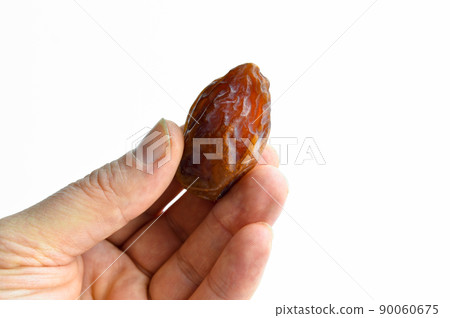 Organic fresh nutritious dried hurma dates medjool grains, on hand Organic fresh nutritious dried hurma dates medjool grains, on hand 90060675