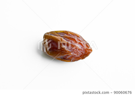 Organic fresh nutritious dried hurma dates medjool grains, on a white background Organic fresh nutritious dried hurma dates medjool grains, on a white background 90060676