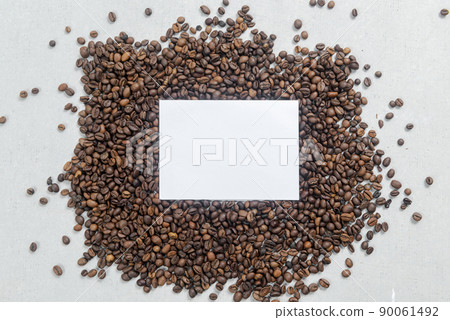 Close-up view of coffee beans and empty paper 90061492