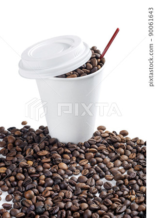 Close up view of a white plastic cup and coffee beans 90061643