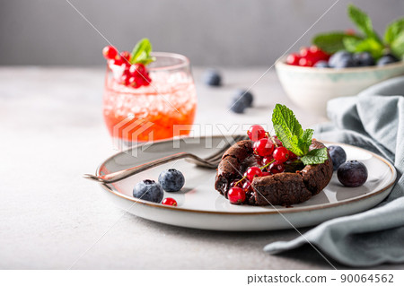 Warm chocolate Lava Cake with berries Warm chocolate Lava Cake with berries 90064562