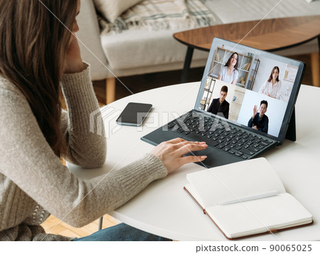 Digital study. Group virtual chat. Online learning. Diverse students working online watching teacher video lesson on laptop screen at home office workplace with open notebook. Digital study. Group virtual chat. Online learning. Diverse students working online watching teacher video lesson on laptop screen at home office workplace with open notebook. 90065025