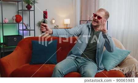 Man blogger influencer taking selfie on smartphone, make virtual social media video online at home Man blogger influencer taking selfie on smartphone, make virtual social media video online at home 90065985