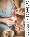 A woman with a cake 90066176