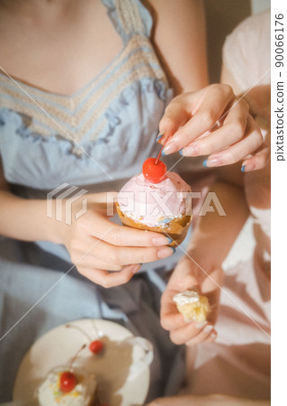 A woman with a cake A woman with a cake 90066176