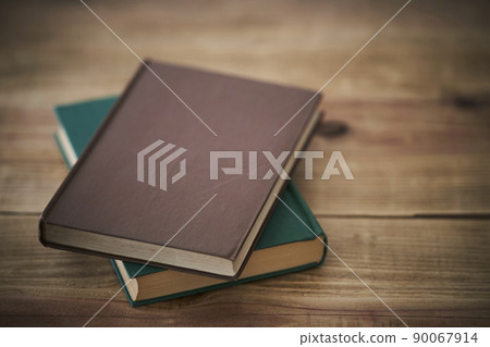 A brown cover book placed on an old desk 90067914