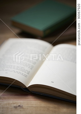 Reading foreign books on the desk Reading foreign books on the desk 90067920