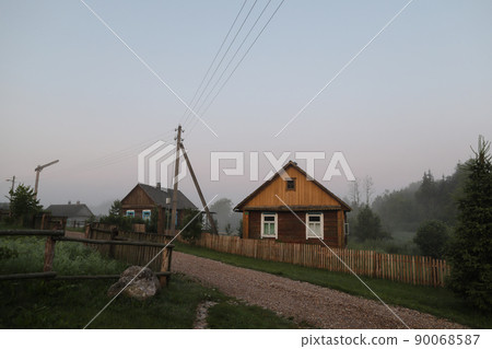 summer picturesque rural landscape with a wooden country farmhouse  90068587