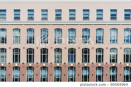 Building background. Front view of windows on colorful wall, modern architecture Building background. Front view of windows on colorful wall, modern architecture 90069969
