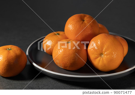 ripe bright fresh tangerines on a plate ripe bright fresh tangerines on a plate 90071477