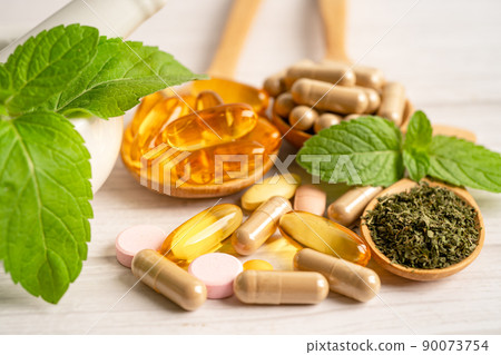 Alternative medicine herbal organic capsule with vitamin E omega 3 fish oil, mineral, drug with herbs leaf natural supplements for healthy good life. 90073754