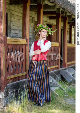 Latvian woman in traditional clothing. Ligo folk. Latvian woman in traditional clothing. Ligo folk. 90074054