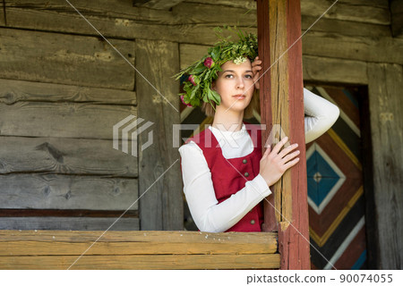 Latvian woman in traditional clothing. Ligo folk. Latvian woman in traditional clothing. Ligo folk. 90074055