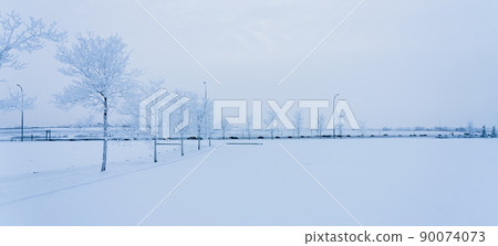 Winter snow city life. An open ground covered with snow. Cold weather concept 90074073