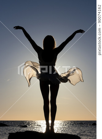 free happy woman silhouette at seaside 90074162