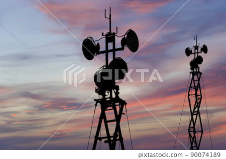 Air defense radars of military mobile anti aircraft systems, modern army industry on the background of the sunset orange sky, Russia 90074189