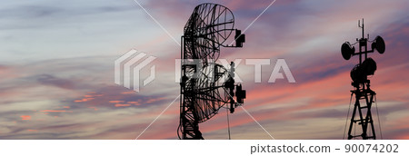 Air defense radars of military mobile anti aircraft systems, modern army industry on the background of the sunset orange sky, Russia 90074202
