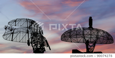 Air defense radars of military mobile anti aircraft systems, modern army industry on the background of the sunset orange sky, Russia 90074278