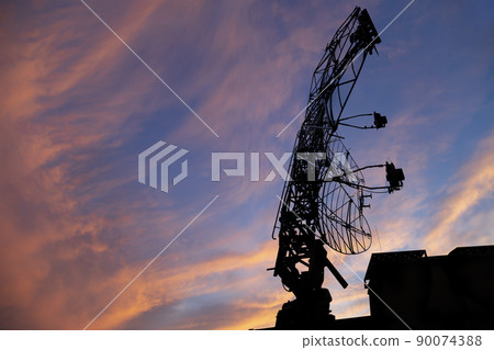 Air defense radars of military mobile anti aircraft systems, modern army industry on the background of the sunset orange sky, Russia 90074388